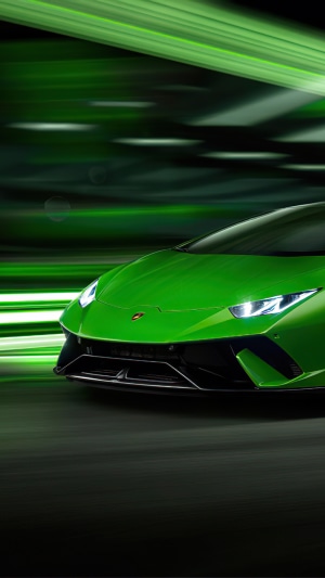 Green Lamborghini Huracan Performante Spyder driving