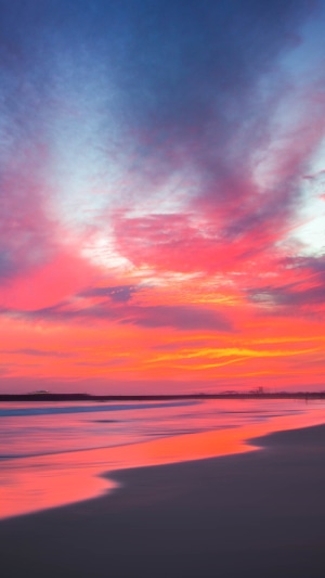 Long exposure beach sunset with colorful clouds