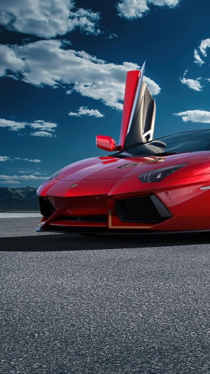 Red Lamborghini Aventador SVJ 63 with doors open