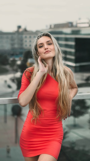 Woman in red dress with blonde hair