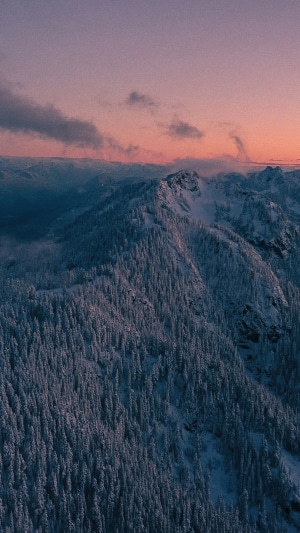 Snow-covered mountains at sunset