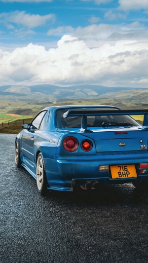 Blue Nissan Skyline GT-R R34 on a road