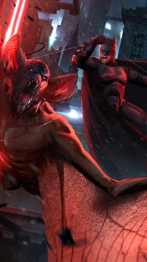Batman fighting a monstrous bat creature