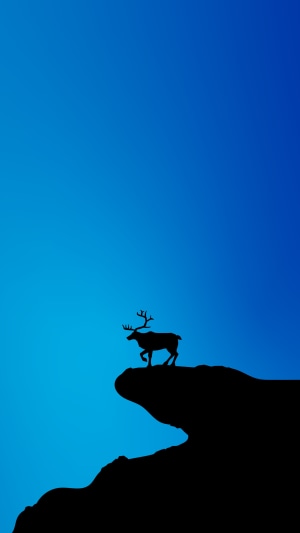 Minimalist silhouette of a reindeer on a cliff edge