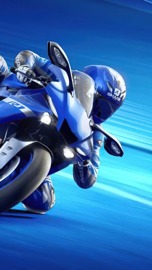 Motorcyclist in blue racing suit on Yamaha R1
