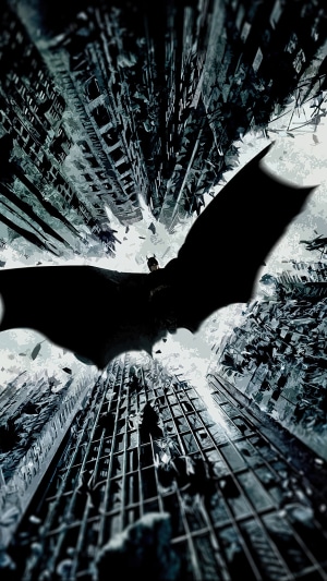 Batman flying over a destroyed city 4K