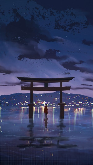 Torii gate on a reflective surface with a person and city lights