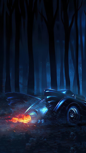 Batman from DC Comics' Batmobile in a dark forest 4K