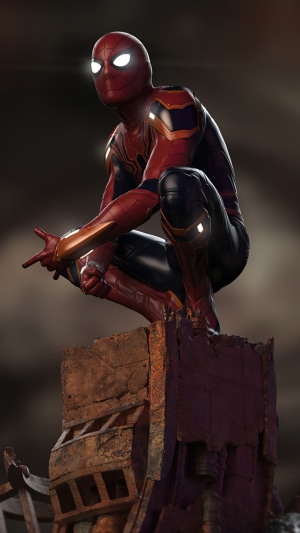 Spider-Man in Iron Spider Suit crouching on ruins