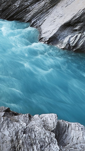 Turquoise river flowing through rocky gorge