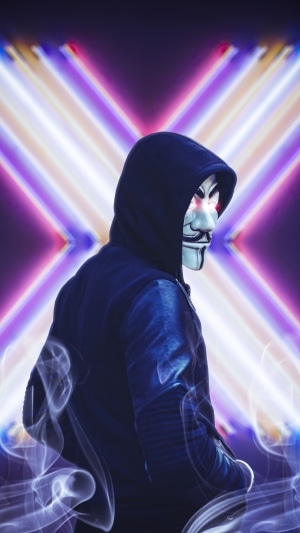 Anonymous mask with glowing eyes and neon background