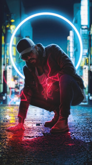 Man in a cap and jacket with neon lights