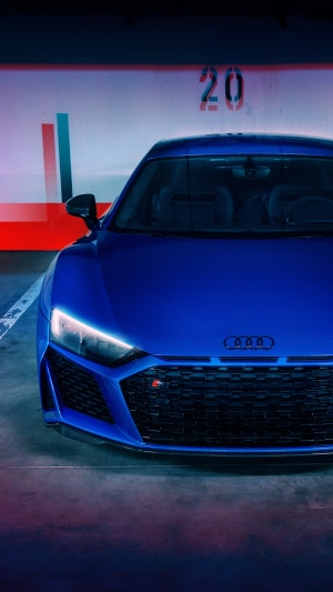 Blue Audi R8 parked in a garage