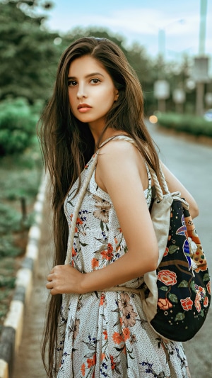 Girl with floral dress and backpack