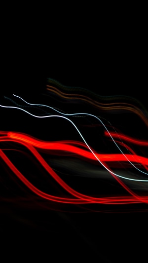 Abstract light trails on black background