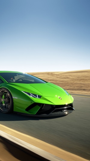 Green Lamborghini Huracan Performante on a road
