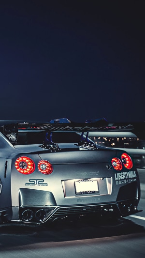 Nissan GTR Sports Car with Liberty Walk Kit at Night