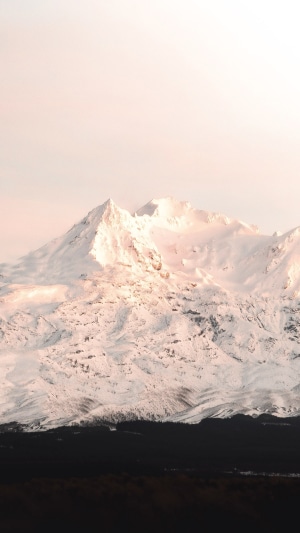 Snow covered mountains in soft light 4K