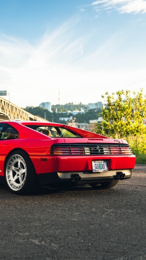 Red Ferrari 348 with Guido license plate