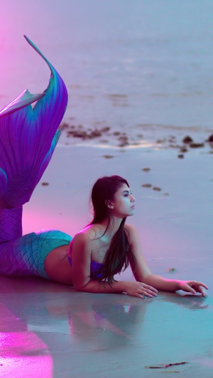 Mermaid model on a beach