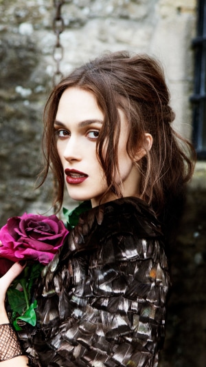 Keira Knightley with a dark rose