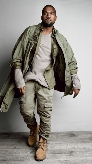 Kanye West in olive green outfit and tan boots