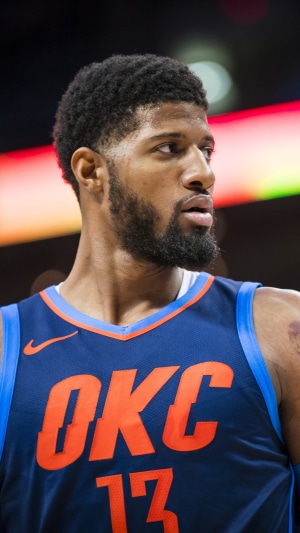 Paul George wearing Oklahoma City Thunder jersey