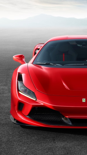 Red Ferrari F8 Tributo car on asphalt