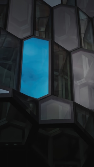 Abstract geometric building facade with blue sky