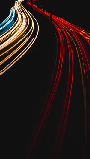 Long exposure of car light trails on a road