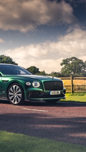 Green Bentley Flying Spur on a Road
