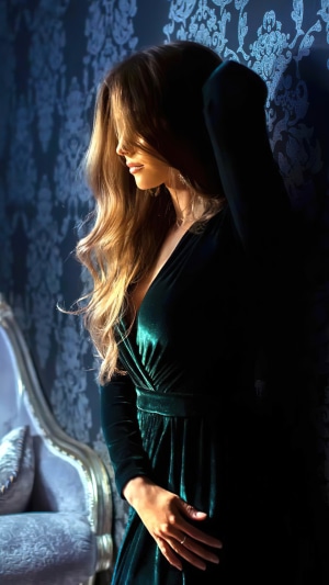 Woman in green velvet dress