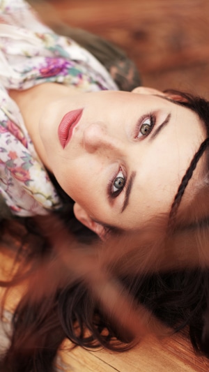 Girl with floral scarf lying down