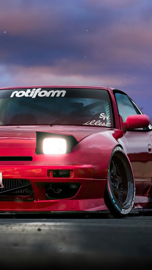 Red Nissan Silvia S13 with Rotiform banner