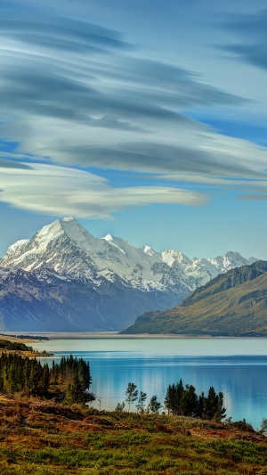 Snow-capped mountains reflected in a lake