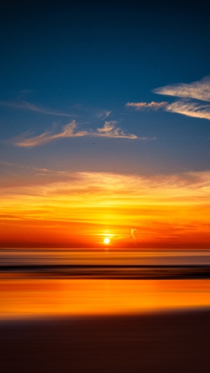 Sunset over the ocean with colorful sky