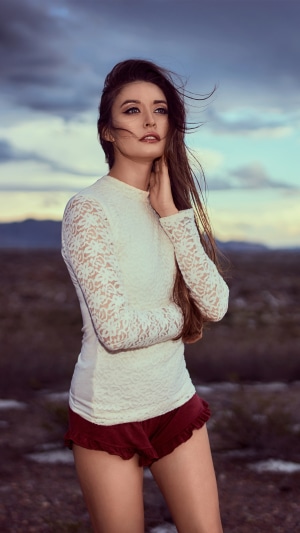 Model in lace top and shorts in desert