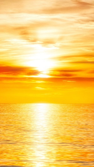 Sunset over the ocean with clouds