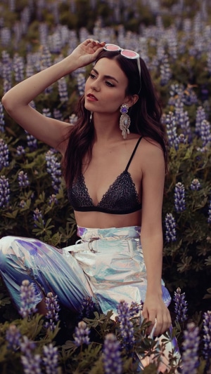 Victoria Justice in a field of flowers