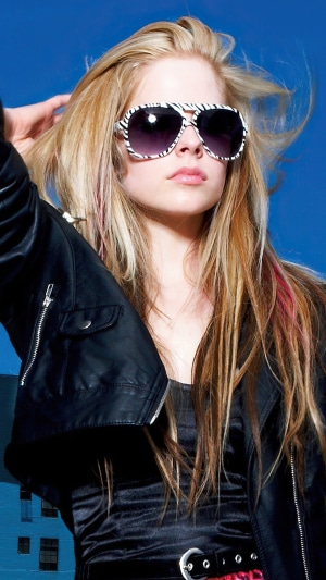 Avril Lavigne wearing sunglasses and leather jacket