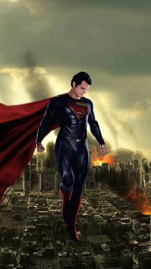 Superman flying over a destroyed city