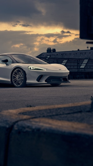 White McLaren GT parked on asphalt