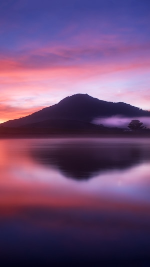 Mountain reflection at sunset with colorful sky