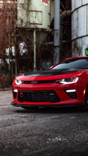 Red Chevrolet Camaro with black hood