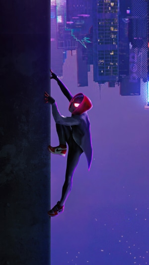 Spider-Man climbing a wall in a city