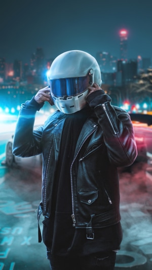 Biker wearing a helmet at night