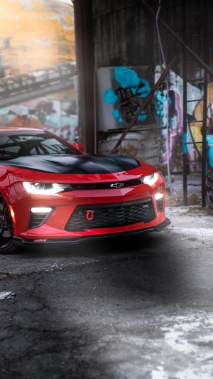 Red Chevrolet Camaro with Graffiti Background