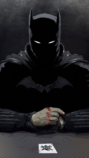 Batman with Joker card and bloody hands