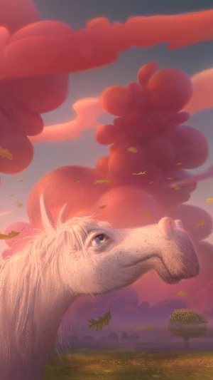 White horse in a field with pink clouds