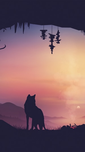 Wolf in cave at sunset with campfire